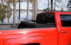 Lund 05-10 Dodge Dakota Fleetside (5.3ft. Bed) Hard Fold Tonneau Cover - Black